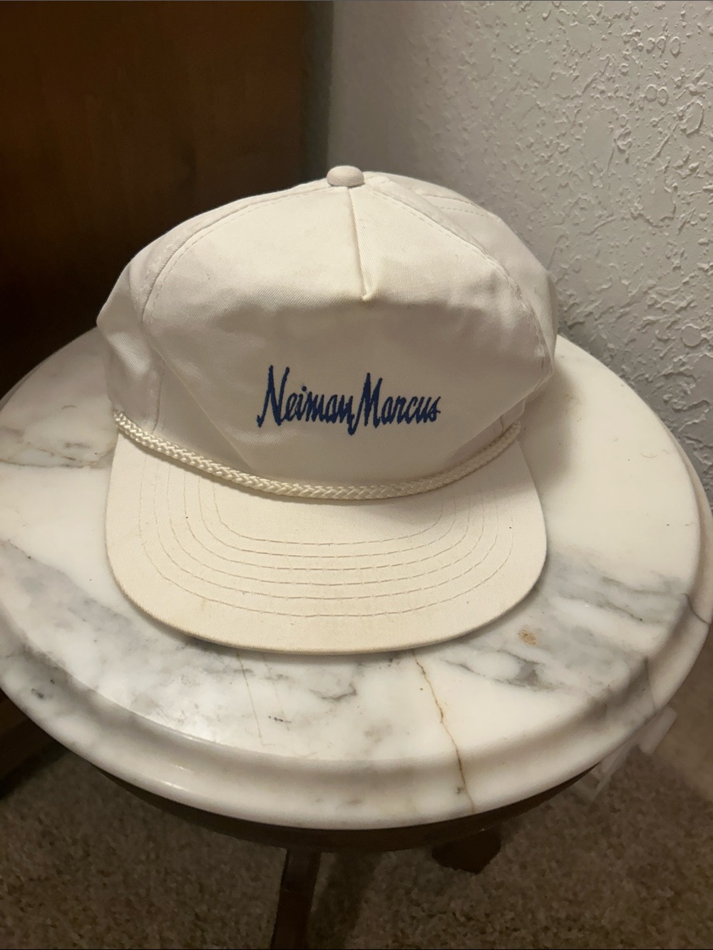 Neiman Marcus Cream Cap with Blue Script Logo and Rope Trim